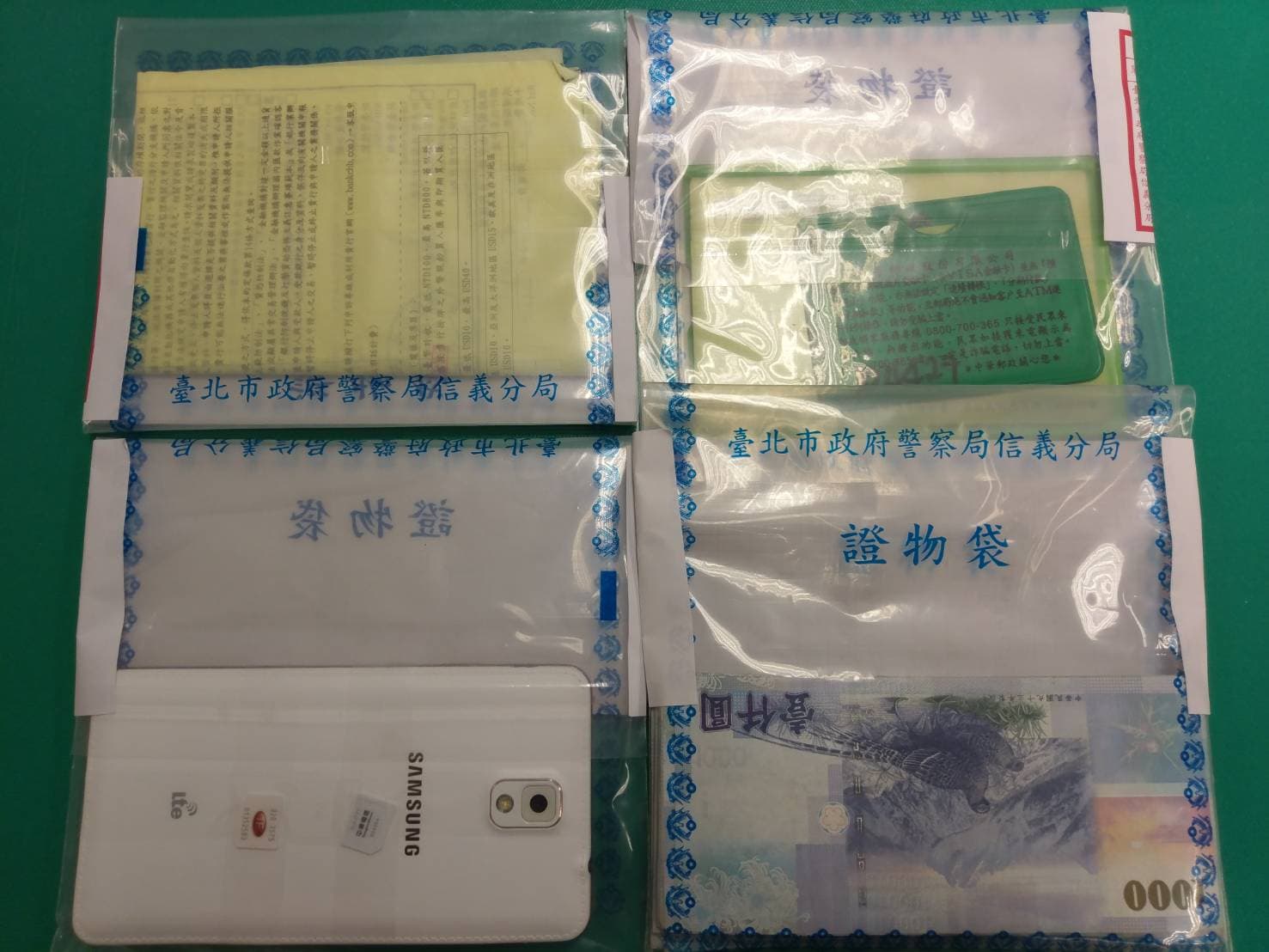 警方現場查扣手機1支、SlM卡2張、郵局存摺及金融卡、匯款水單3張以及贓款新台幣10萬元整。（信義分局提供）
