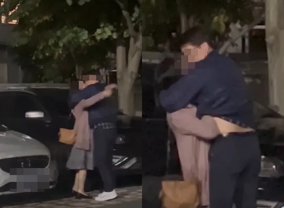 科技大廠處長與女同事當街擁吻，女方還伸手進對方衣服愛撫。（翻攝Dcard）