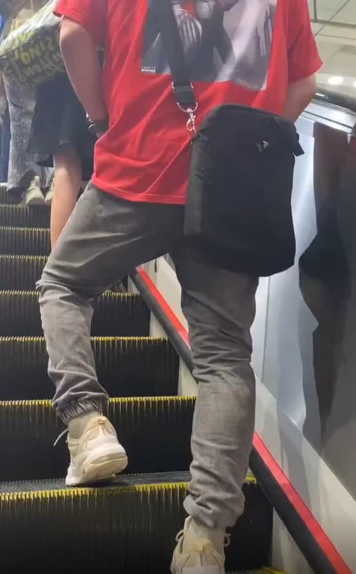 女網友搭乘忠孝復興站通往文湖線途中的電扶梯時，竟然目睹前方男子直接原地開尿。（翻攝自Threads）